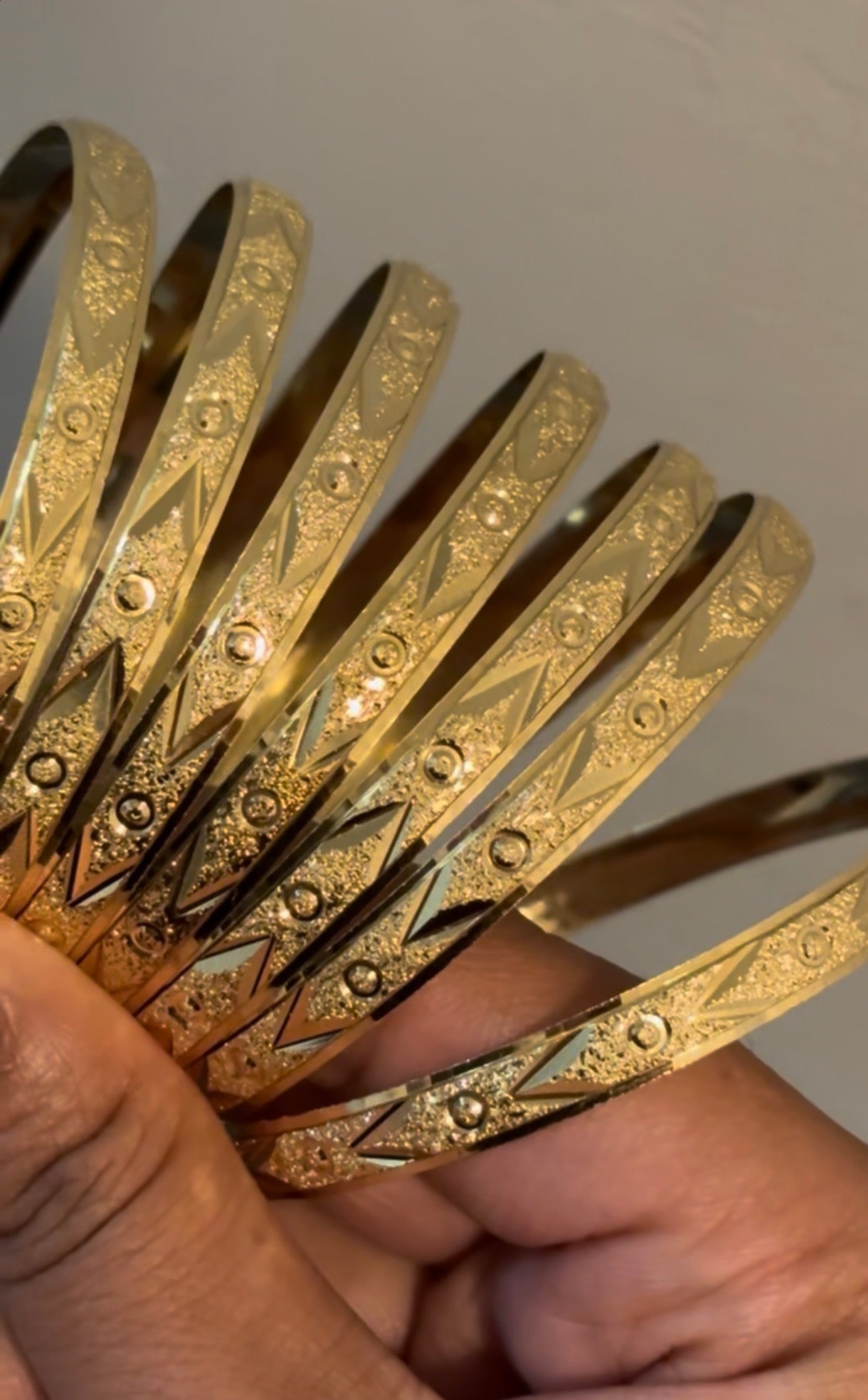 7 pack of Gold Bangles